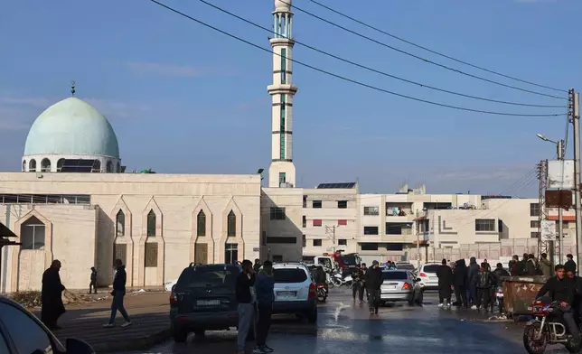 Syrian security forces secure the area outside the Imam Ali bin Abi Talib Mosque in the predominantly Alawite Wadi al-Dhahab neighborhood after an explosion inside the mosque, in Homs, Syria, Friday, Dec. 26, 2025. (AP Photo)