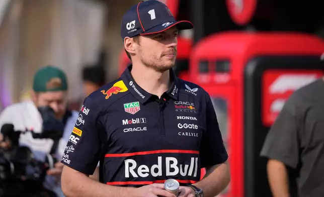 Red Bull driver Max Verstappen of the Netherlands walks through the paddock at the Yas Marina Circuit ahead of the Abu Dhabi Grand Prix in Abu Dhabi, United Arab Emirates, Thursday, Dec. 4, 2025. (AP Photo/Darko Bandic)