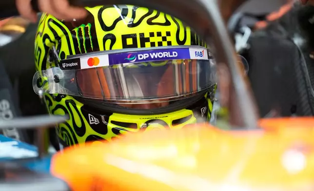 McLaren driver Lando Norris of Britain gets ready for the first practice for the he Abu Dhabi Formula One Grand Prix in Abu Dhabi, United Arab Emirates, Friday, Dec. 5, 2025. (AP Photo/Darko Bandic)