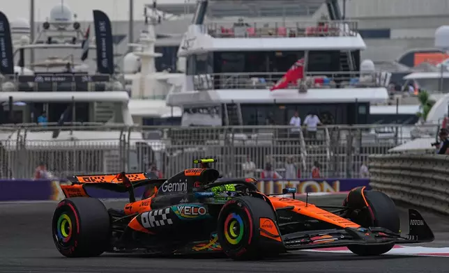 McLaren driver Lando Norris of Britain in action during a first practice for the he Abu Dhabi Formula One Grand Prix in Abu Dhabi, United Arab Emirates, Friday, Dec. 5, 2025. (AP Photo/Fatima Shbair)