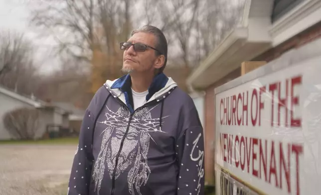 Joshua Gay, a former participant in the Clark County Health Department's syringe exchange program who is now in recovery from substance use disorder, poses for a portrait in front of his church Tuesday, Nov. 23, 2025, in Austin, Ind. (AP Photo/Obed Lamy)