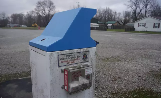 A sharps disposal bin to safely discard used syringes and lancets is installed in Austin, Ind., by the Scott County Health Department Tuesday, Nov. 23, 2025. (AP Photo/Obed Lamy)