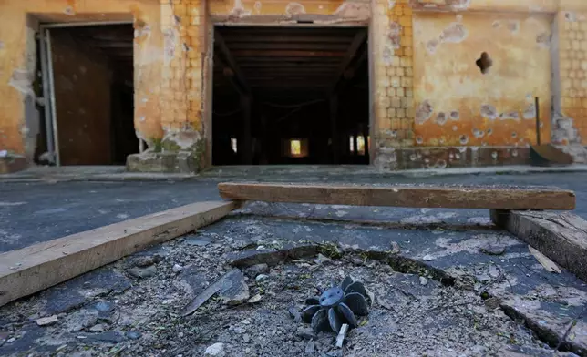 FILE - In this photo taken during a trip organised by pro-military Myanmar media, an exploded ordnance lies in the ground in Kyaukme, northern Shan State, Myanmar, Oct. 10, 2025. (AP Photo/Aung Shine Oo, File)