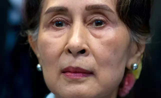 FILE - Myanmar's leader Aung San Suu Kyi waits to address judges of the International Court of Justice on the second day of three days of hearings in The Hague, Netherlands, on Dec. 11, 2019. (AP Photo/Peter Dejong, File)