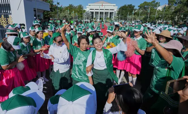 FILE - Supporters of Myanmar's military backed Union Solidarity and Development Party (USDP), dance on the first day of campaign for the upcoming general election, in Naypyitaw, Myanmar, Oct. 28, 2025.(AP Photo/Aung Shine Oo, File)