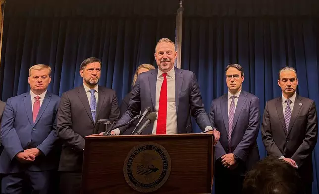 First Assistant U.S. Attorney Joe Thompson describes a sprawling fraud investigation involving state-run programs in Minnesota at a news conference Thursday, Dec. 18, 2025, in Minneapolis. (AP Photo/Giovanna Dell'Orto)