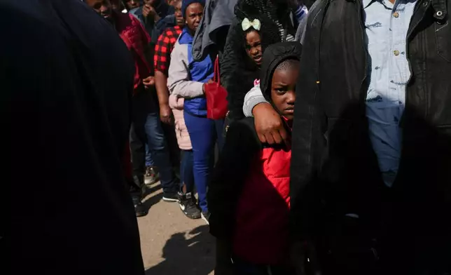 Migrants from Haiti stand in line outside the Mexican Commission for Refugee Aid office to apply for asylum in Mexico City, Jan. 28, 2025. (AP Photo/Marco Ugarte, File)