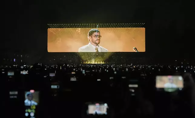 Puerto Rican musician Bad Bunny performs in concert during his "DeBÍ TiRAR MáS FOToS" tour in Mexico City, Dec. 10, 2025. (AP Photo/Eduardo Verdugo, File)