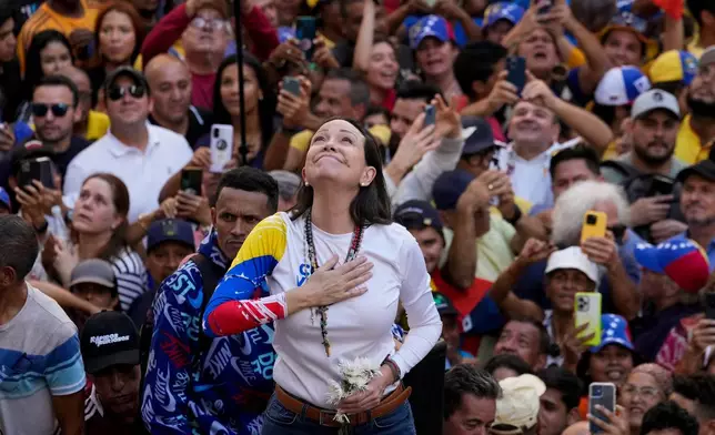 Venezuelan opposition leader Maria Corina Machado addresses supporters at a protest against President Nicolas Maduro in Caracas, Venezuela, Jan. 9, 2025, a day ahead of Maduro's inauguration ceremony where he will be sworn in for a third term. (AP Photo/Ariana Cubillos, File)