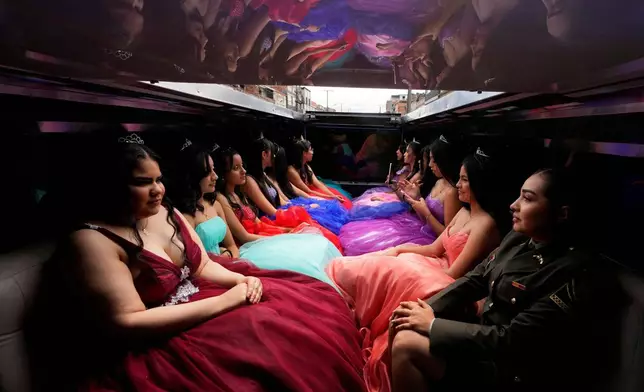 Quinceañeras ride in a limousine as part of their celebration in Bogota, Colombia, May 2, 2025. (AP Photo/Fernando Vergara, File)