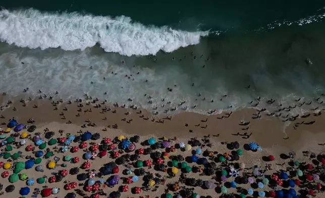 People crowd Ipanema beach during summer in Rio de Janeiro, Feb. 16, 2025. (AP Photo/Bruna Prado, File)