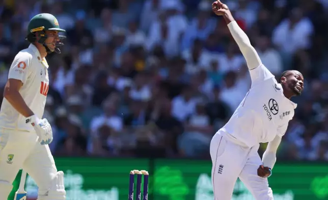 England's Jofra Archer bowls during play on day four of the third Ashes cricket test between England and Australia in Adelaide, Australia, Saturday, Dec. 20, 2025. (AP Photo/James Elsby)