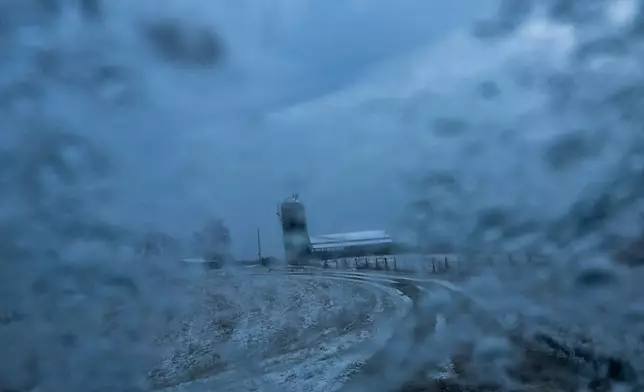 Ice covers a windshield on a farm in Robertson County, Kentucky on Dec. 9, 2025. (AP Photo/Michael Swensen)