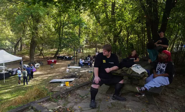 People attend the Baltimore Gift Economy's third annual "Finding Home" gathering, Sunday, Oct. 19, 2025, in Baltimore. (AP Photo/Jessie Wardarski)