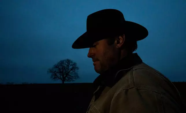 Josh Pyles poses for a portrait on a farm he leases from the family of Kentucky writer Wendell Berry in Henry County, Ky., Saturday, Dec. 13, 2025. (AP Photo/Michael Swensen)