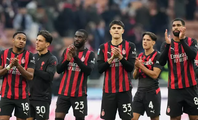 AC Milan players greet fans at the end of the Serie A soccer match between AC Milan and Sassuolo, in Milan, Italy, Sunday, Dec. 14, 2025. (AP Photo/Luca Bruno)