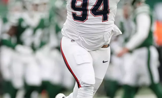 New England Patriots defensive tackle Cory Durden reacts during the second half of an NFL football game against the New York Jets, Sunday, Dec. 28, 2025, in East Rutherford, N.J. (AP Photo/Adam Hunger)