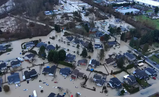 This image made from a video provided by the Pacific Police Department shows homes underwater, Tuesday, Dec. 16, 2025, in Pacific, Wash. (Pacific Police Department via AP)