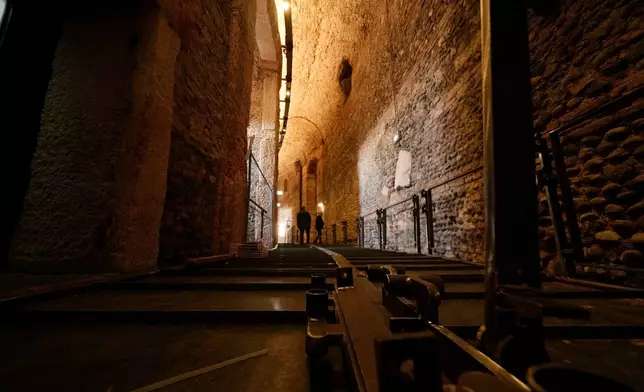 Walkways for disabled access are under construction in one of the corridors at the Arena of Verona, Italy, Wednesday, Dec. 10, 2025. (AP Photo/Luca Bruno)