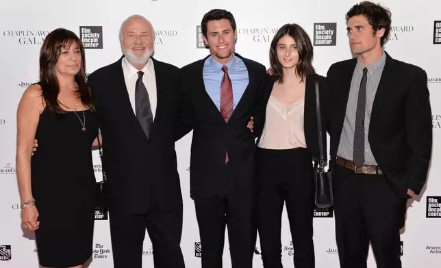 FILE - Honoree Rob Reiner, second left, poses with his wife Michele, left, and children Nick, center, Romy, and Jake at the 41st Annual Chaplin Award Gala at Avery Fisher Hall, April 28, 2014, in New York. (Photo by Evan Agostini/Invision/AP, File)