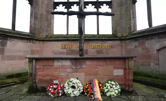 The wreaths laid on behalf of Britain's Duke of Kent, Germany's President Frank-Walter Steinmeier and his wife Elke Budenbender, at the old Coventry Cathedral, in Coventry, England, Friday, Dec. 5, 2025, on the final day of the state visit to the UK. (Jacob King/Pool Photo via AP)