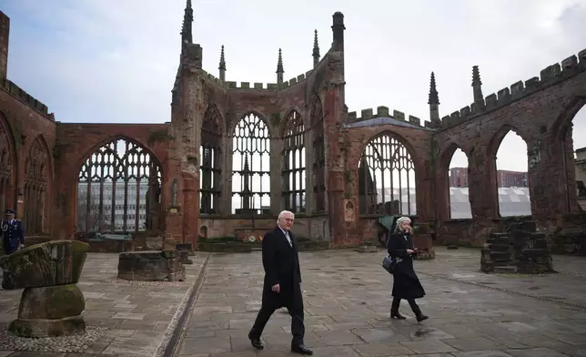 Germany's President Frank-Walter Steinmeier tours the old Coventry Cathedral, in Coventry, England, Friday, Dec. 5, 2025, on the final day of the state visit to the UK. (Christopher Furlong/Pool Photo via AP)