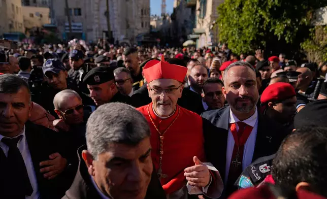 Latin Patriarch Pierbattista Pizzaballa, the top Catholic clergyman in the Holy Land, arrives at the Church of the Nativity, traditionally believed to be the birthplace of Jesus, on Christmas Eve, in the West Bank city of Bethlehem, Wednesday, Dec. 24, 2025. (AP Photo/Nasser Nasser)