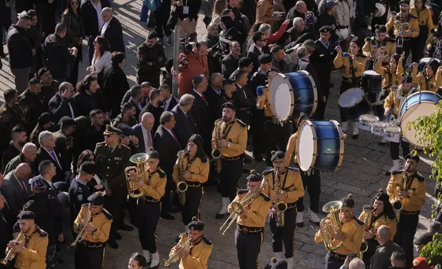 Palestinian scout bands parade at the Manger Square near the Church of the Nativity, traditionally believed to be the birthplace of Jesus, on Christmas Eve, in the West Bank city of Bethlehem, Wednesday, Dec. 24, 2025. (AP Photo/Mahmoud Illean)