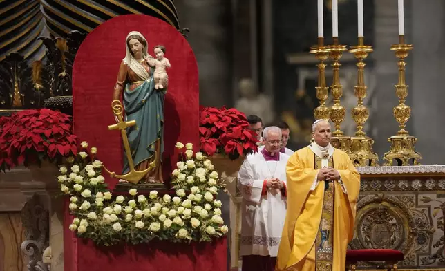 Pope Leo XIV celebrates the Christmas Eve Mass in St. Peter's Basilica at The Vatican, Wednesday, Dec.24, 2025. (AP Photo/Gregorio Borgia)