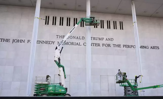New signage, The Donald J. Trump and The John F. Kennedy Memorial Center for the Performing Arts, is unveiled on the Kennedy Center, Friday, Dec. 19, 2025, in Washington. (AP Photo/Jacquelyn Martin)