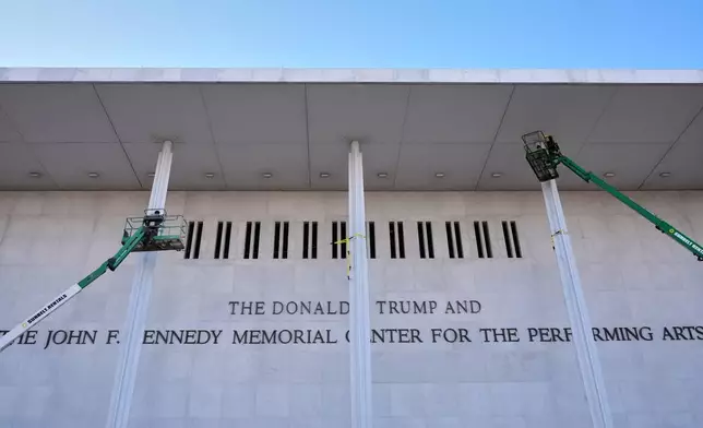 New signage, The Donald J. Trump and The John F. Kennedy Memorial Center For The Performing Arts, is unveiled on the Kennedy Center, Friday, Dec. 19, 2025, in Washington. (AP Photo/Jacquelyn Martin)