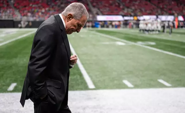 Atlanta Falcons owner Arthur Blank walks on the sideline during the second half of an NFL football game against the Seattle Seahawks, Sunday, Dec. 7, 2025, in Atlanta. (AP Photo/Mike Stewart)