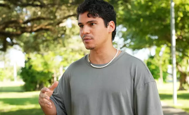 Gustavo Ascani, a digital content creator, speaks about the upcoming Miami mayor runoff election, Thursday, Dec. 4, 2026, in Miami. (AP Photo/Marta Lavandier)