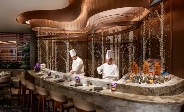 Welcoming guests on the other side of the entrance is the marble oyster counter, where guests can witness their delicacies freshly shucked to serve.