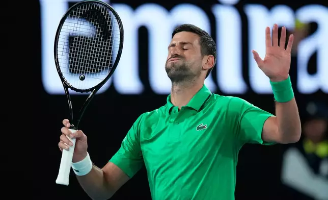 Novak Djokovic of Serbia reacts during his first round match against Pedro Martinez of Spain at the Australian Open tennis championship in Melbourne, Australia, Monday, Jan. 19, 2026. (AP Photo/Aaron Favila)