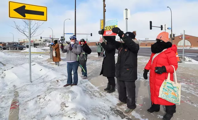 Protesters gather outside an event venue, as Vice President J.D. Vance visits Minneapolis, Thursday, Jan. 22, 2026. (AP Photo/Adam Bettcher)