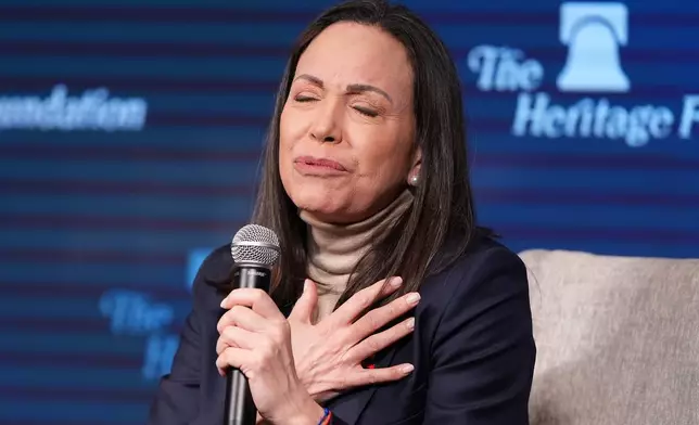 Venezuelan opposition leader Maria Corina Machado speaks at the Heritage Foundation, an influential conservative think tank, a day after meeting with President Donald Trump and members of Congress, on Capitol Hill in Washington, Friday, Jan. 16, 2026. (AP Photo/J. Scott Applewhite)