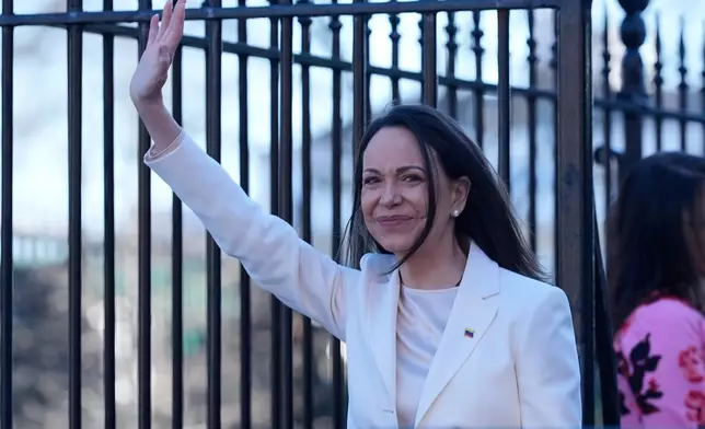 Venezuelan opposition leader María Corina Machado waves to supporters on Pennsylvania Avenue as she leaves the White House after meeting with President Donald Trump Thursday, Jan. 15, 2026, in Washington. (AP Photo/Pablo Martinez Monsivais)
