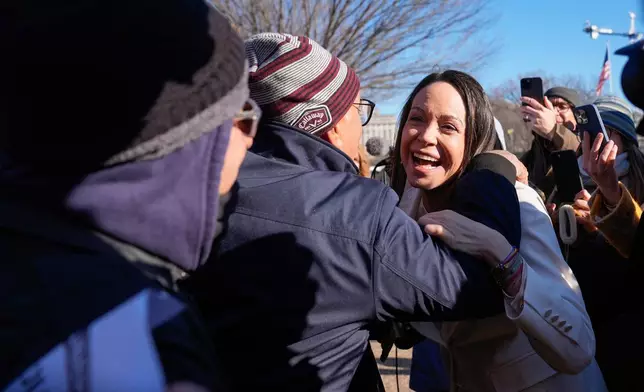 Venezuelan opposition leader MarÌa Corina Machado greets supporters on Pennsylvania Avenue near the White House after meeting with President Donald Trump Thursday, Jan. 15, 2026, in Washington. (AP Photo/Pablo Martinez Monsivais)