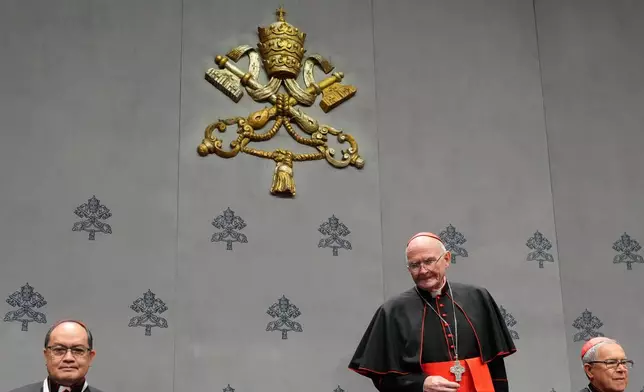 From left, Cardinals Pablo Virgilio Siongco David, Stefen Brislin and Luis Jose Rueda Aparicio arrive at a press conference at the end of Pope Leo XIV's first Extraordinary Consistory, a special formal assembly convening the College of Cardinals from around the world, at the Vatican, Thursday, Jan. 8, 2026. (AP Photo/Gregorio Borgia)