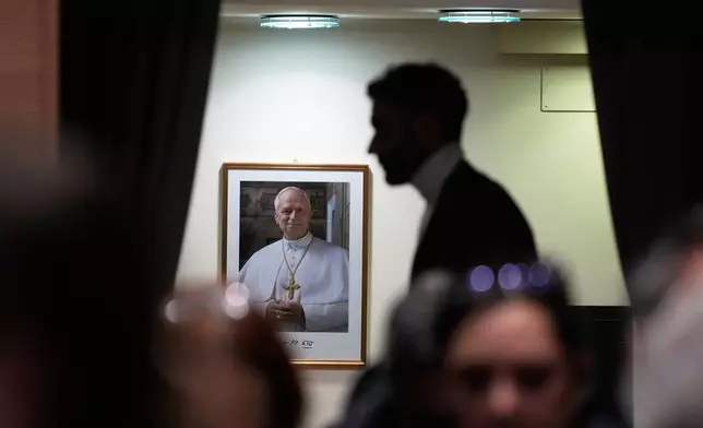 Journalists wait for the start of a press conference at the end of Pope Leo XIV's first Extraordinary Consistory, a special formal assembly convening the College of Cardinals from around the world, at the Vatican, Thursday, Jan. 8, 2026. (AP Photo/Gregorio Borgia)