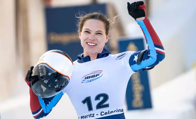 Kelly Curtis of the U.S. reacts after placing second in the Women's Skeleton World Cup in St. Moritz, Switzerland, Friday, Jan. 9, 2026. (Mayk Wendt/Keystone via AP)