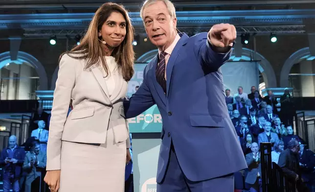 Reform UK leader Nigel Farage and former home secretary Suella Braverman speaking during a Reform UK press conference in London, Monday, Jan. 26, 2026, after announcing Braverman has defected to the party. (Stefan Rousseau/PA via AP)