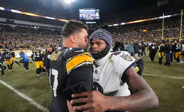 Pittsburgh Steelers defensive tackle Cameron Heyward, left, greets Baltimore Ravens quarterback Lamar Jackson (8) after an NFL football game Sunday, Jan. 4, 2026, in Pittsburgh. (AP Photo/Gene J. Puskar)