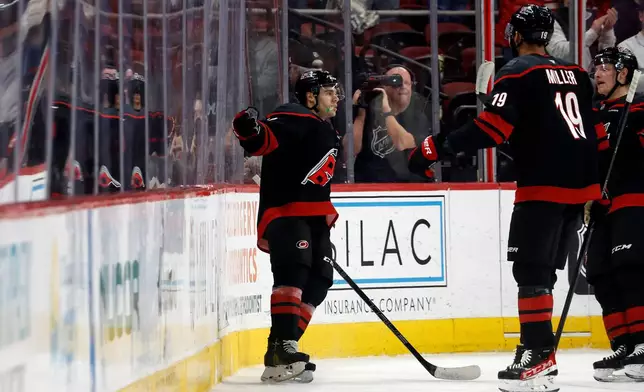 Carolina Hurricanes' Logan Stankoven (22) celebrates his goal against the Dallas Stars during the first period of an NHL hockey game in Raleigh, N.C., Tuesday, Jan. 6, 2026. (AP Photo/Karl DeBlaker)