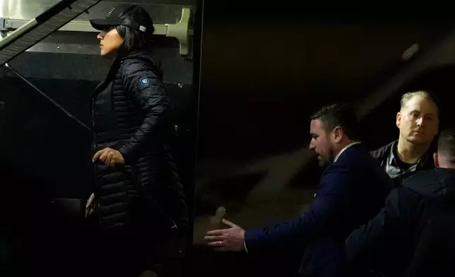 Director of National Intelligence Tulsi Gabbard, left, and FBI Deputy Director Andrew Bailey, enter a command vehicle as the FBI takes Fulton County 2020 Election ballots, Wednesday, Jan. 28, 2026, in Union City, Ga., near Atlanta. (AP Photo/Mike Stewart)