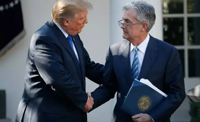 FILE - President Donald Trump shakes hands with Federal Reserve board member Jerome Powell after announcing him as his nominee for the next chair of the Federal Reserve, in the Rose Garden of the White House in Washington, Nov. 2, 2017. (AP Photo/Alex Brandon, File)