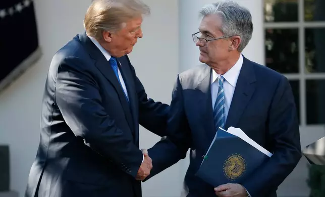 FILE - President Donald Trump shakes hands with Federal Reserve board member Jerome Powell after announcing him as his nominee for the next chair of the Federal Reserve, in the Rose Garden of the White House in Washington, Nov. 2, 2017. (AP Photo/Alex Brandon, File)