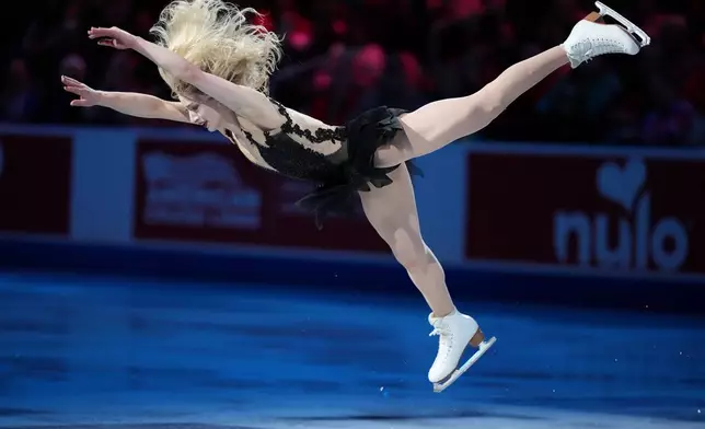 Amber Glenn skates during the "Making Team USA" performance at the U.S. Figure Skating Championships, Sunday, Jan. 11, 2026, in St. Louis. (AP Photo/Stephanie Scarbrough)