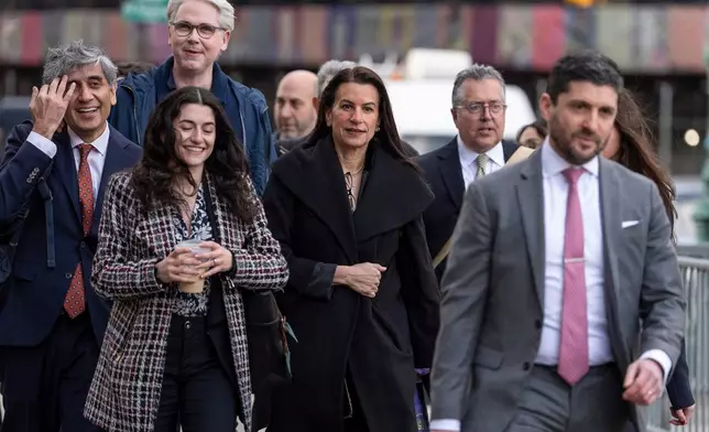 Legal team of Luigi Mangione including Karen Friedman Agnifilo, center, and Marc Agnifilo, second right, arrive at Manhattan federal court, Friday, Jan. 9, 2026, in New York. (AP Photo/Yuki Iwamura)